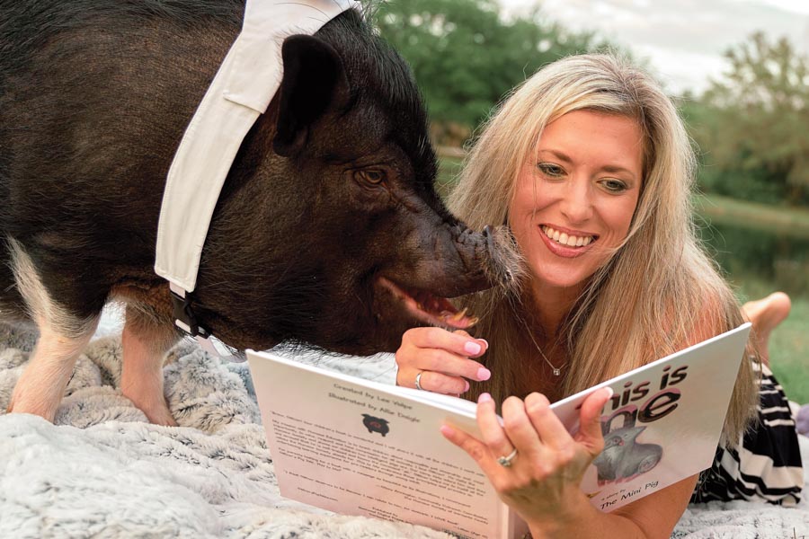 Author Lee Volpe and Officer the Mini Pig, photography by Wyatt Kostygan