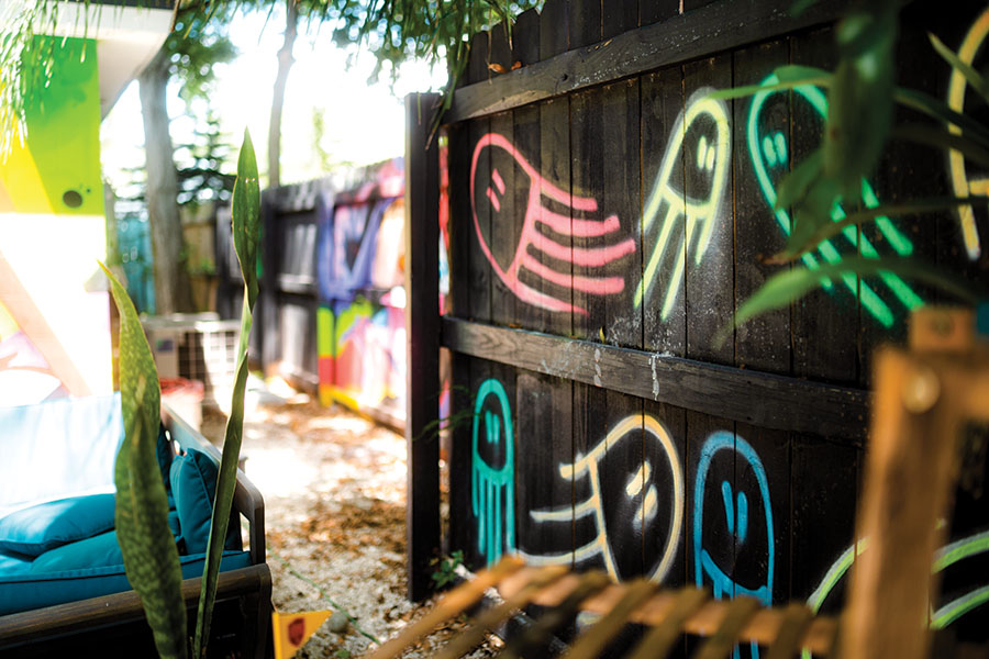 Eclectic and eye-catching graffiti murals cover  walls, fences and houses in Bradenton’s Village of the Arts. Photography by Wyatt Kostygan