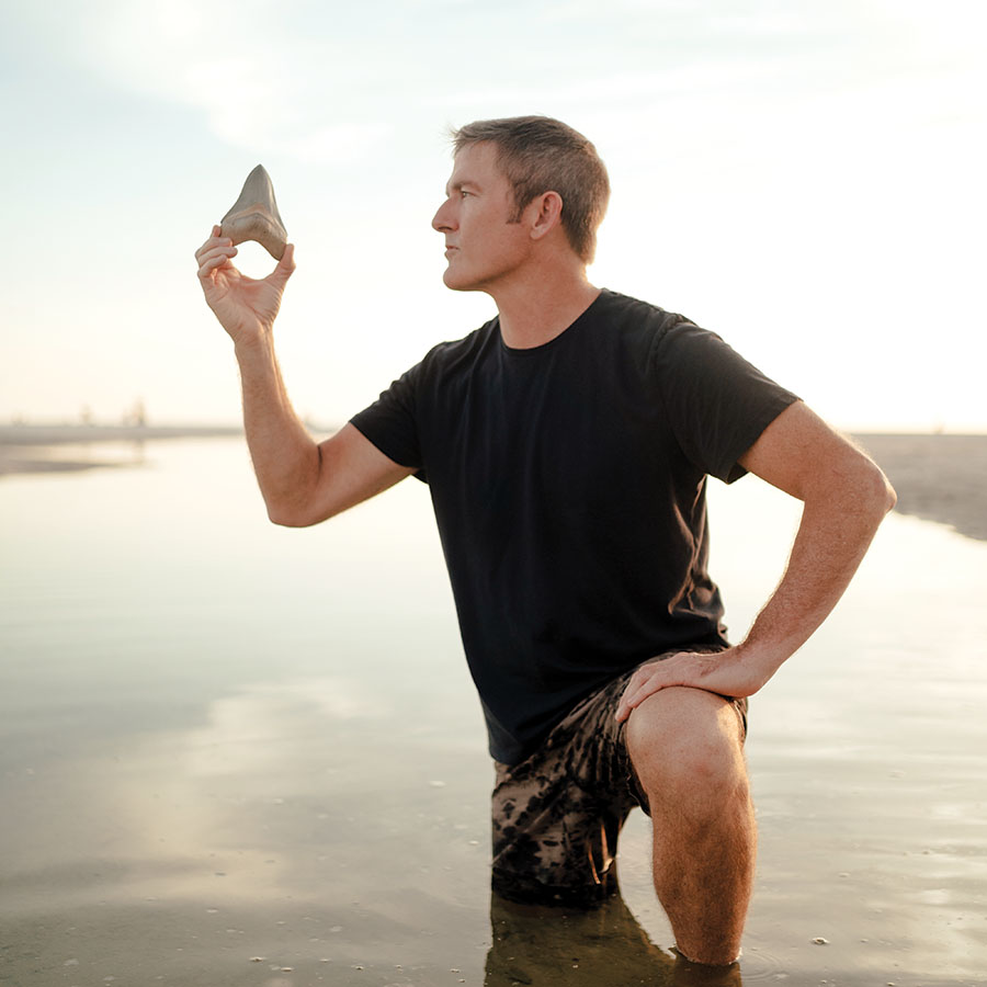 Zach Frignoca, professional shark tooth hunter and owner of Primitive Past, dives for fossilized shark teeth along the coast of Venice.
