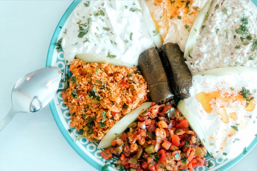 A mezze sampler offers diners a broad survey of Turkish appetizers, from smoky baba ganoush to ezme salad.