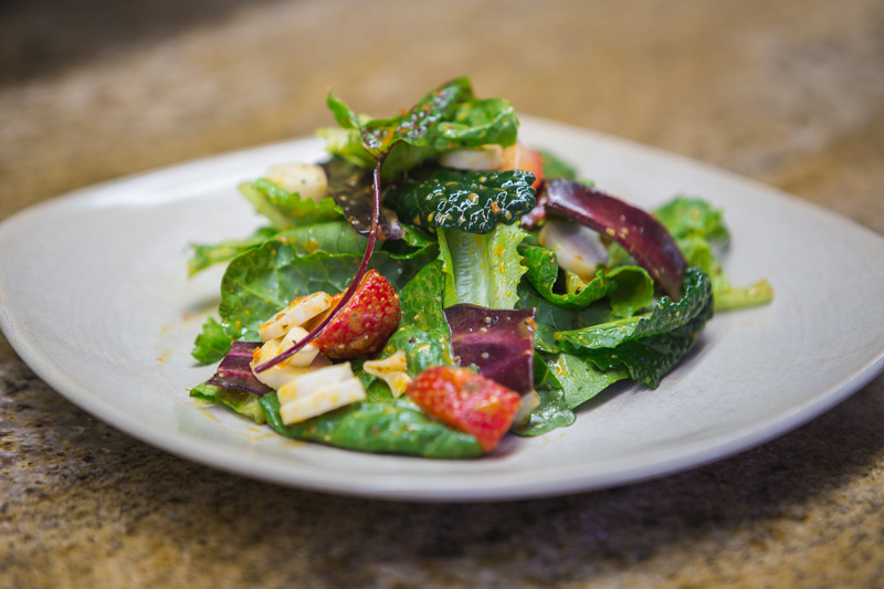 1289 Palm avenue salad contains strawberries, hearts of palm, heirloom carrots and goji berry vinaigrette. Photo by Wyatt Kostygan.