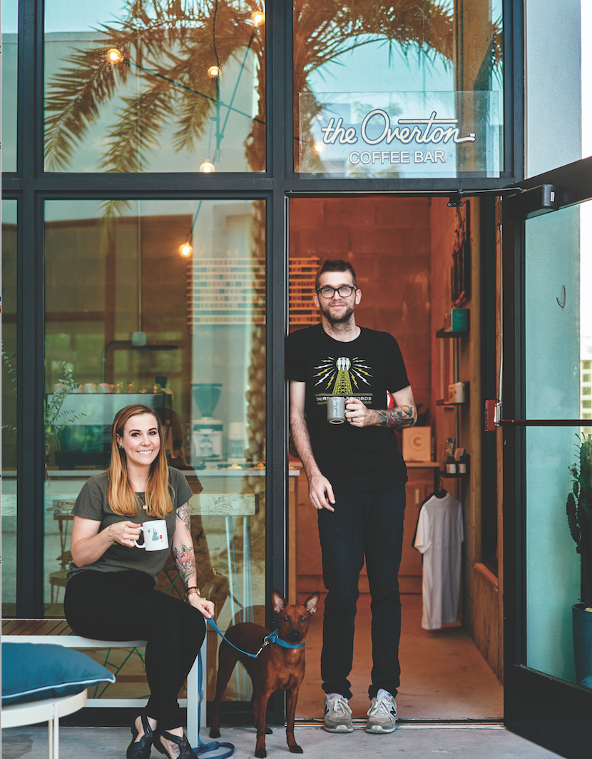 Evan and Kristin Cooper and Scoobi, guarding their coffee sanctuary.