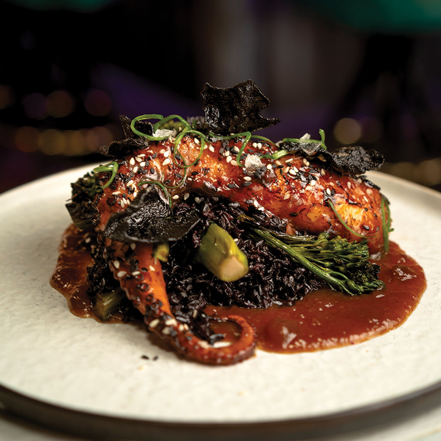 Exquisitely charred, the Kung Pao  octopus cllings to the broccolini. Photography by Wyatt Kostygan.