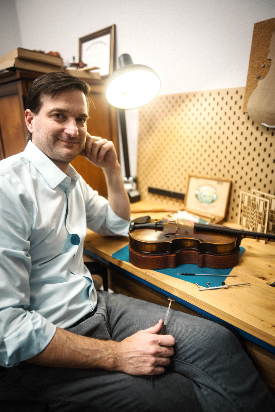  Jamie Ruetz tinkering with repairs on a violin