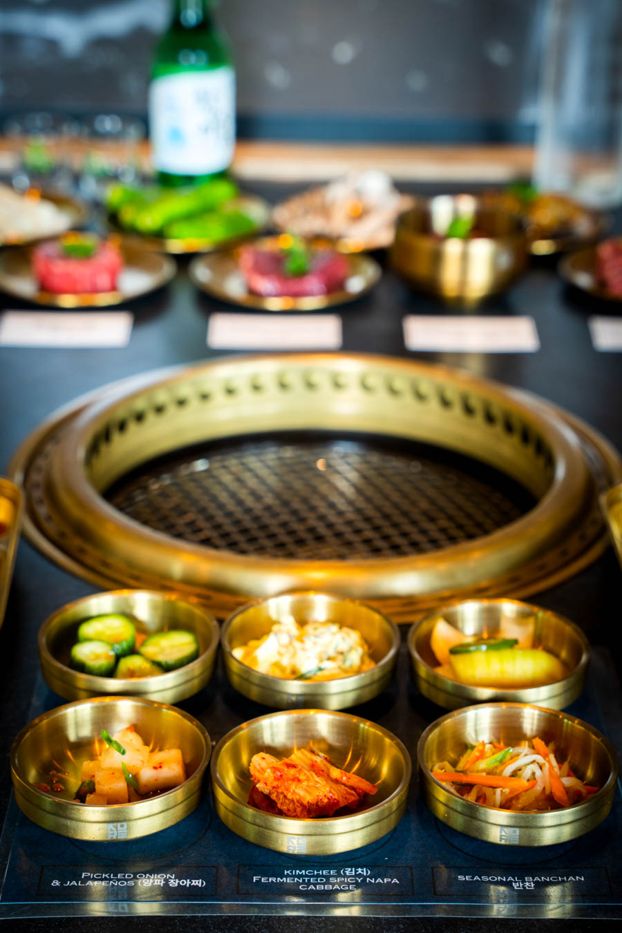 While the combination of meats and banchan heightens the communal motif, a large menu of more traditional, sizable cuts of meat are available to grill at the table too.